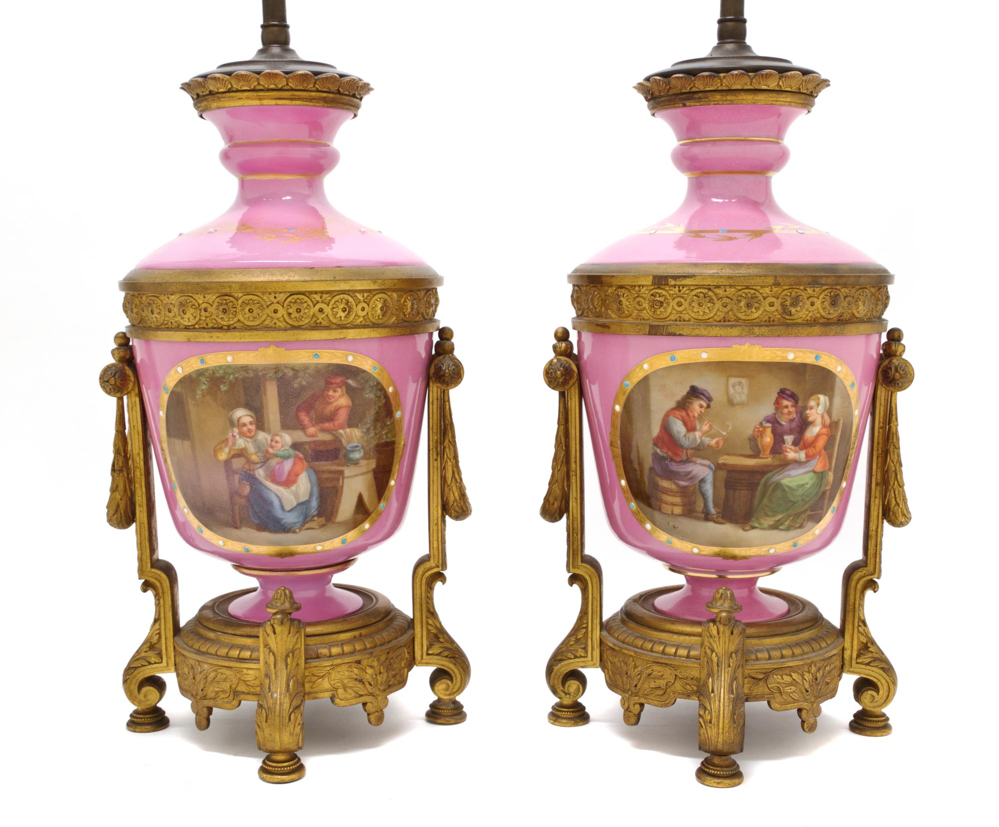 A Pair of Sevres Style Porcelain and Gilt Bronze Mounted Urns, Height of urn 13 5/8 inches.