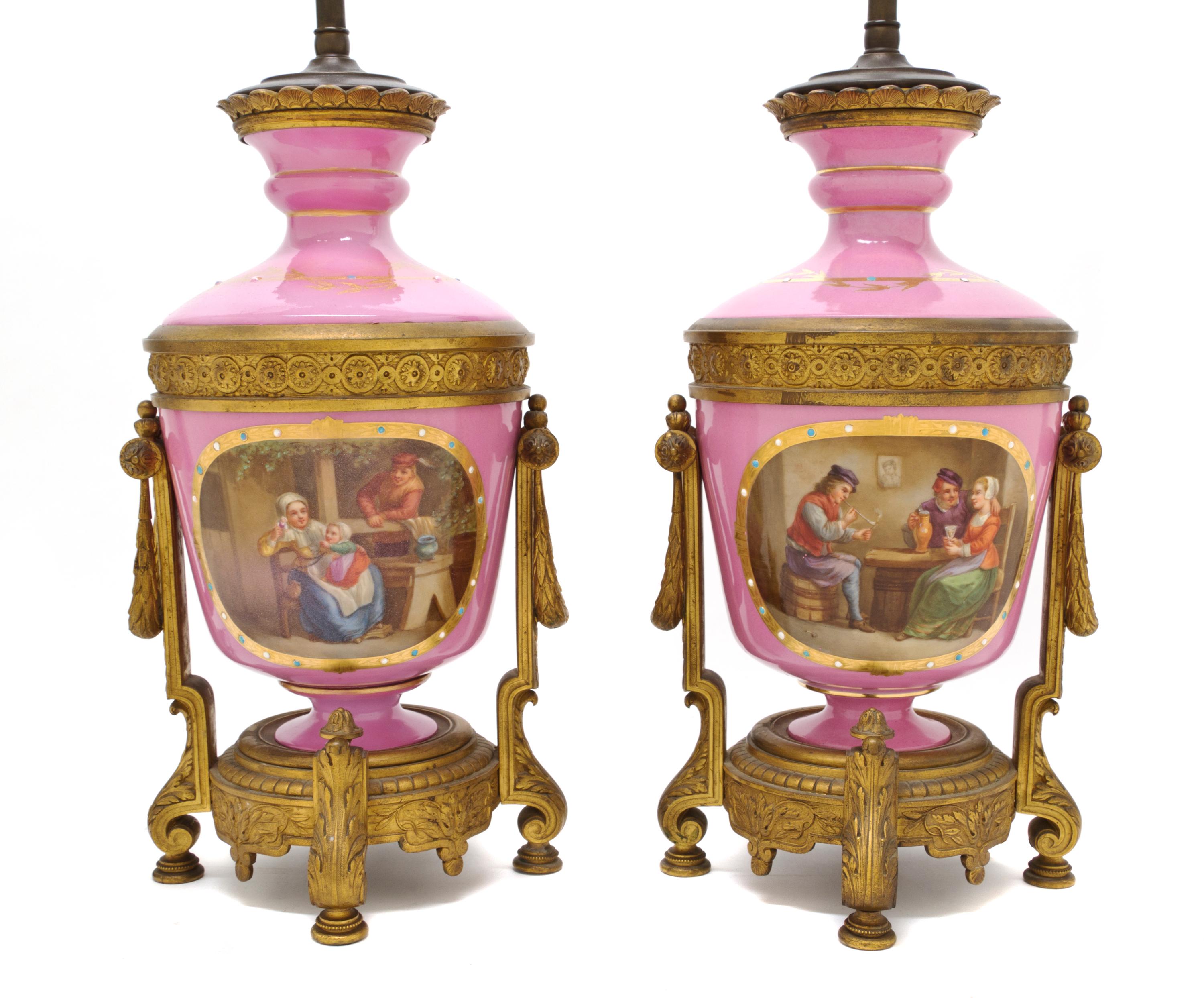 A Pair of Sevres Style Porcelain and Gilt Bronze Mounted Urns, Height of urn 13 5/8 inches.