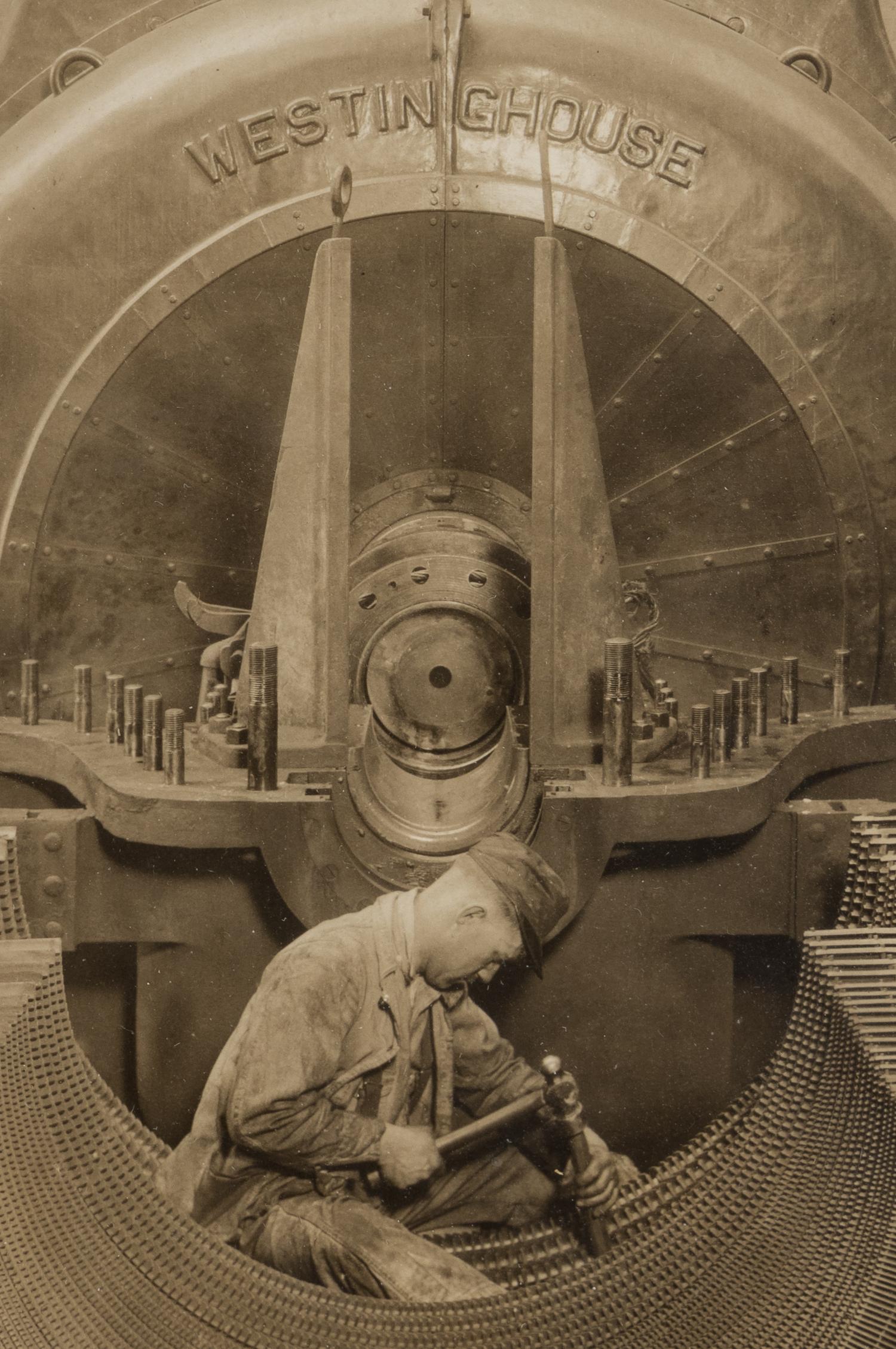 Lewis Hine (1874-1940) The heart of the turbine: Repairing turbine in power house, 1930