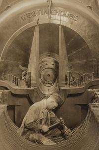 Lewis Hine (1874-1940) The heart of the turbine: Repairing turbine in power house, 1930