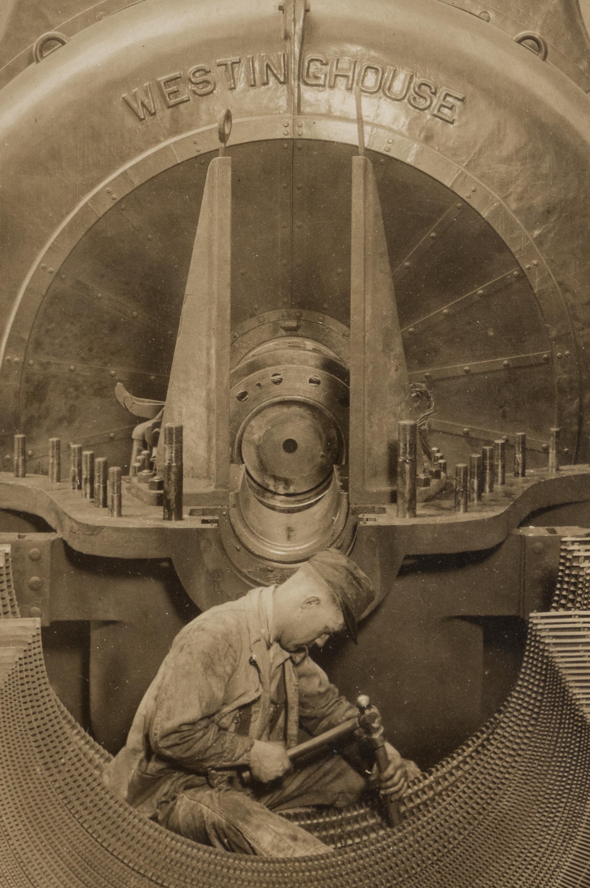 Lewis Hine (1874-1940) The heart of the turbine: Repairing turbine in power house, 1930