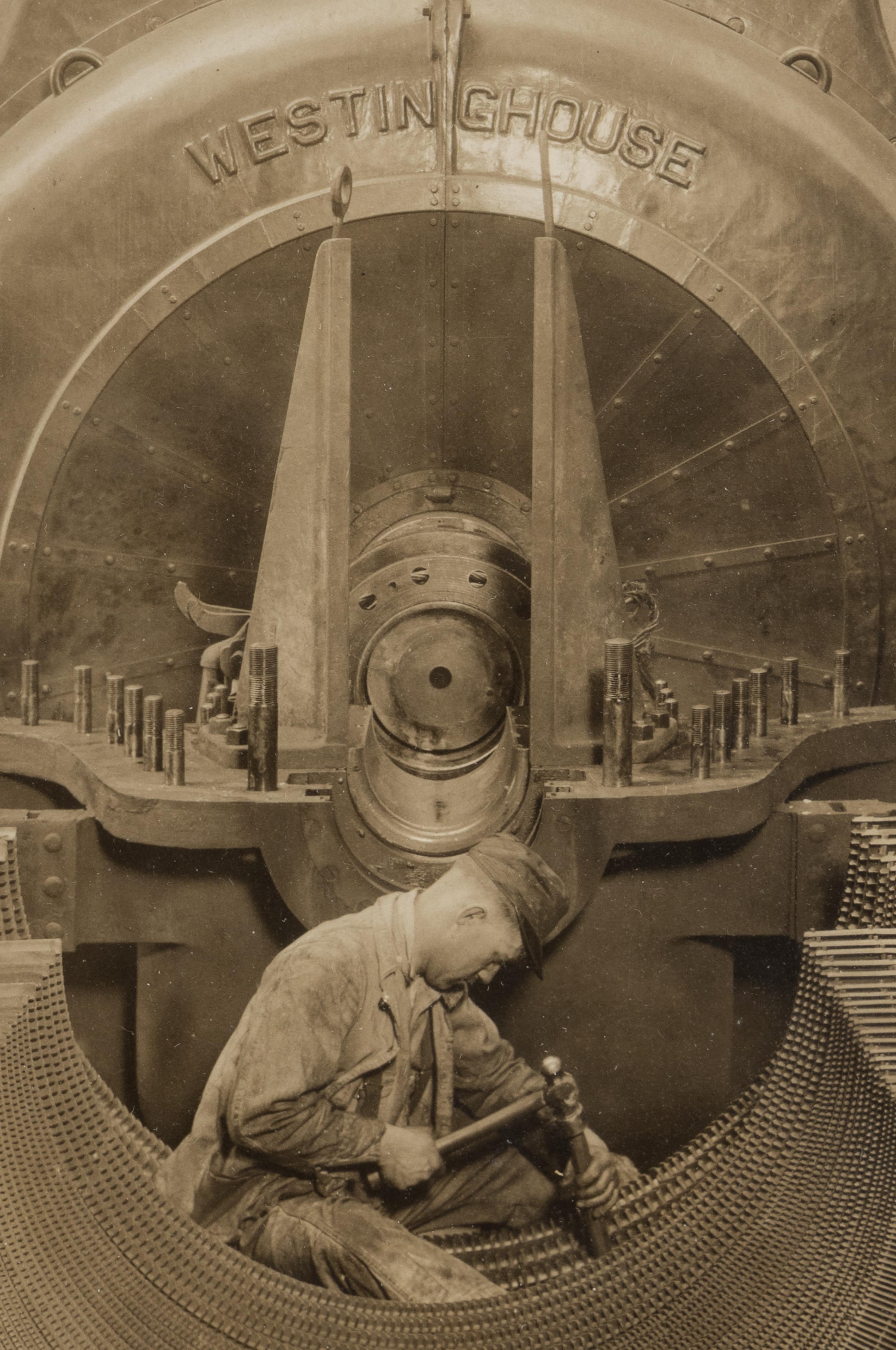 Lewis Hine (1874-1940) The heart of the turbine: Repairing turbine in power house, 1930