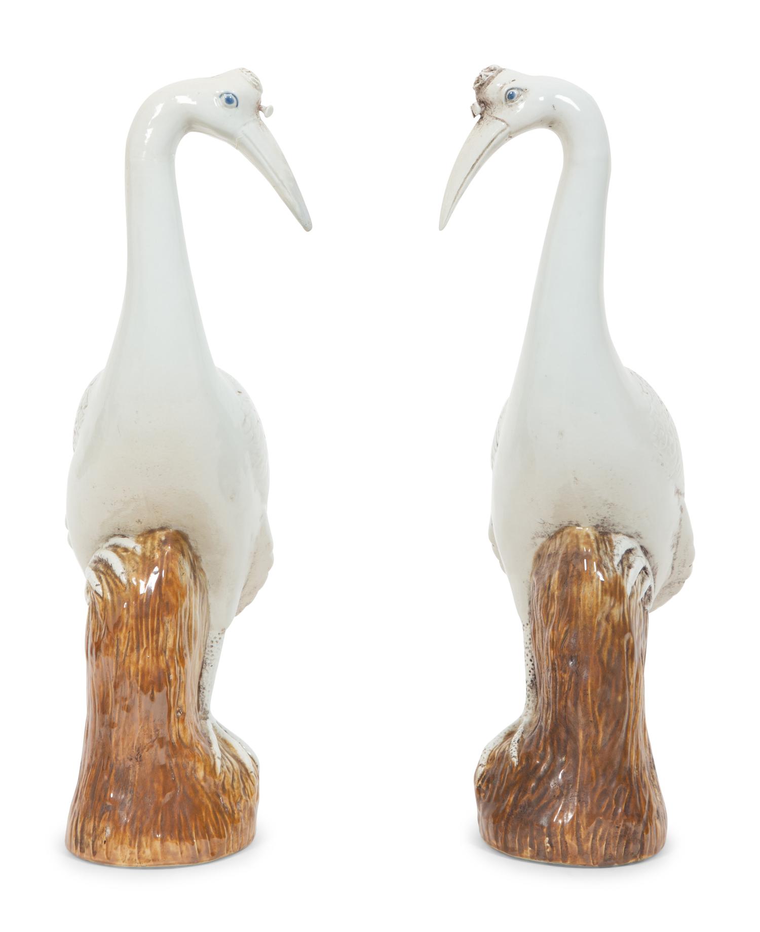 A Pair of Chinese Glazed Ceramic Cranes