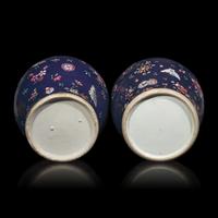 A Pair of Chinese Enameled Blue-Ground Porcelain Jars and Covers, First Half 19th Century — 清中期 藍地粉彩蝶戀花紋將軍罐一對