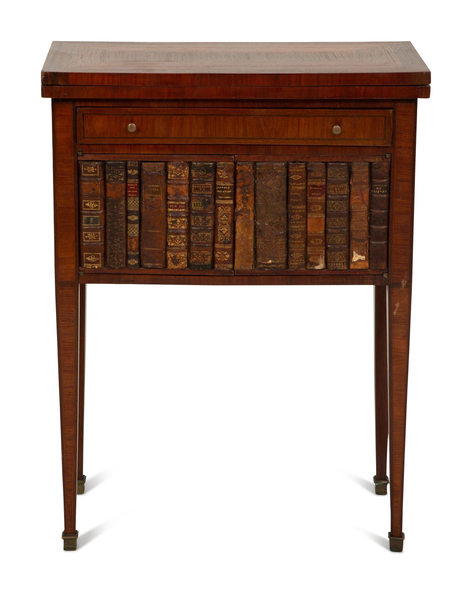 A Directoire Style Mahogany and Rosewood Small Cabinet with Faux-Leather Book Doors