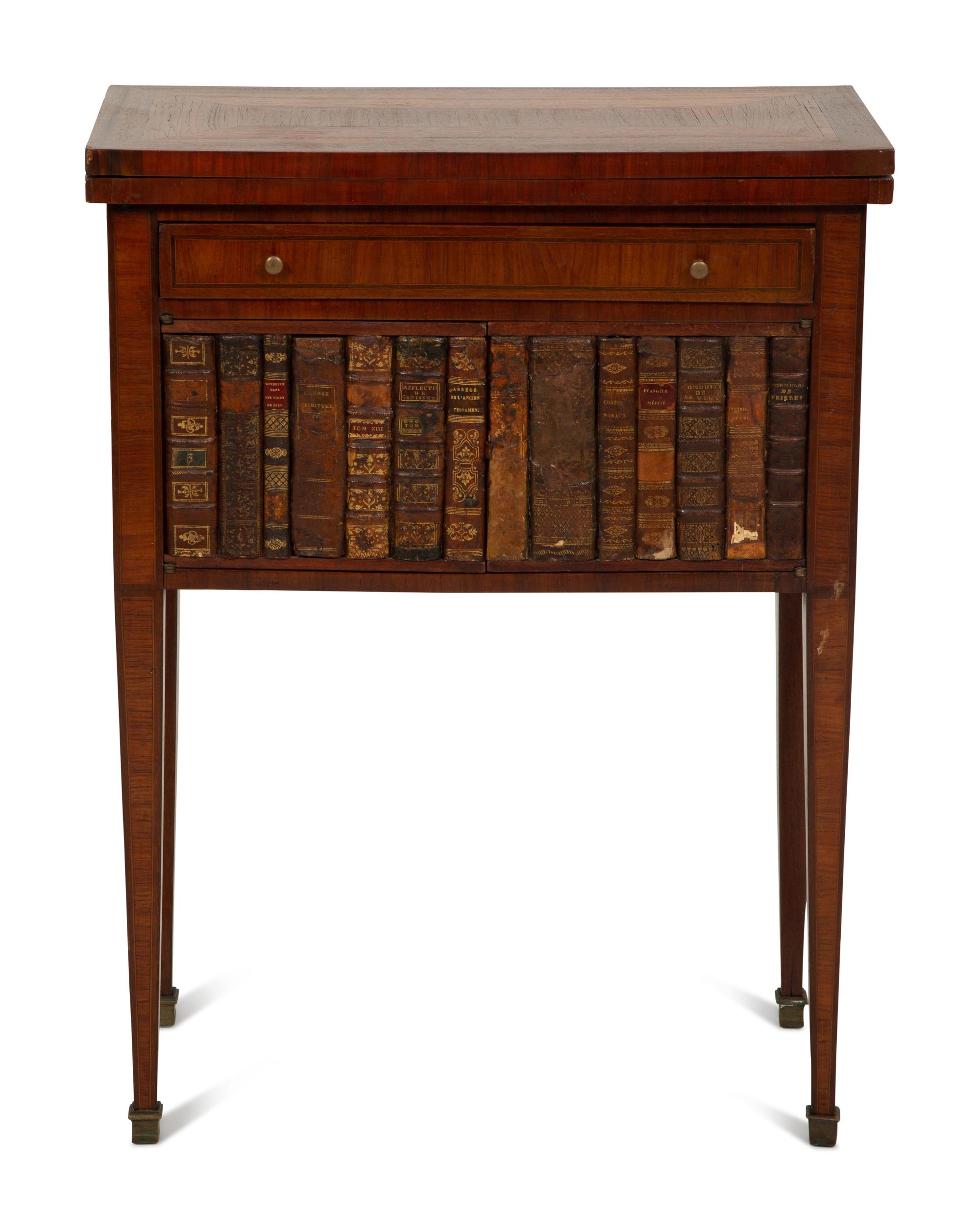 A Directoire Style Mahogany and Rosewood Small Cabinet with Faux-Leather Book Doors