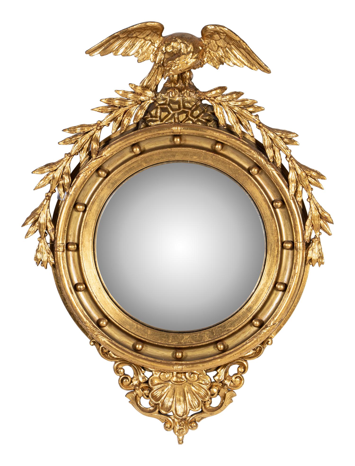 A Federal Style Eagle and Shell Giltwood Bull's Eye Mirror