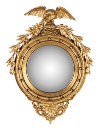 A Federal Style Eagle and Shell Giltwood Bull's Eye Mirror
