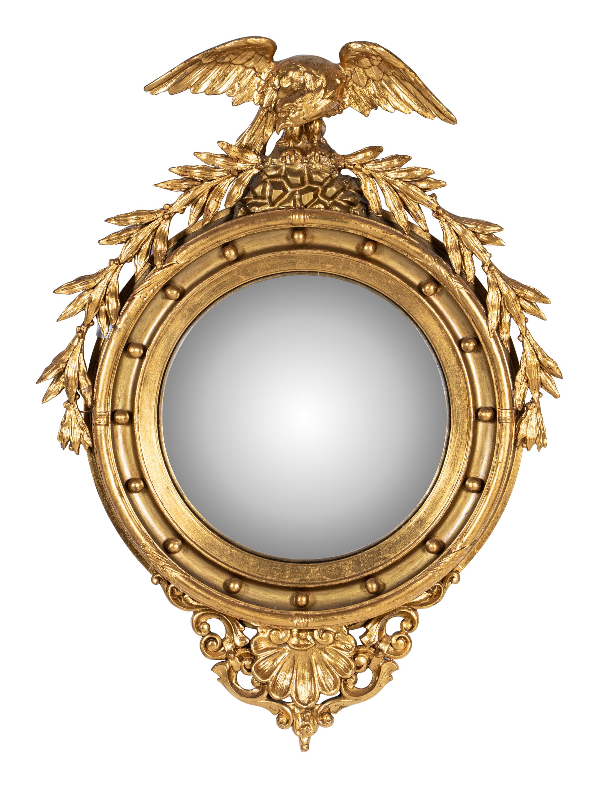 A Federal Style Eagle and Shell Giltwood Bull's Eye Mirror