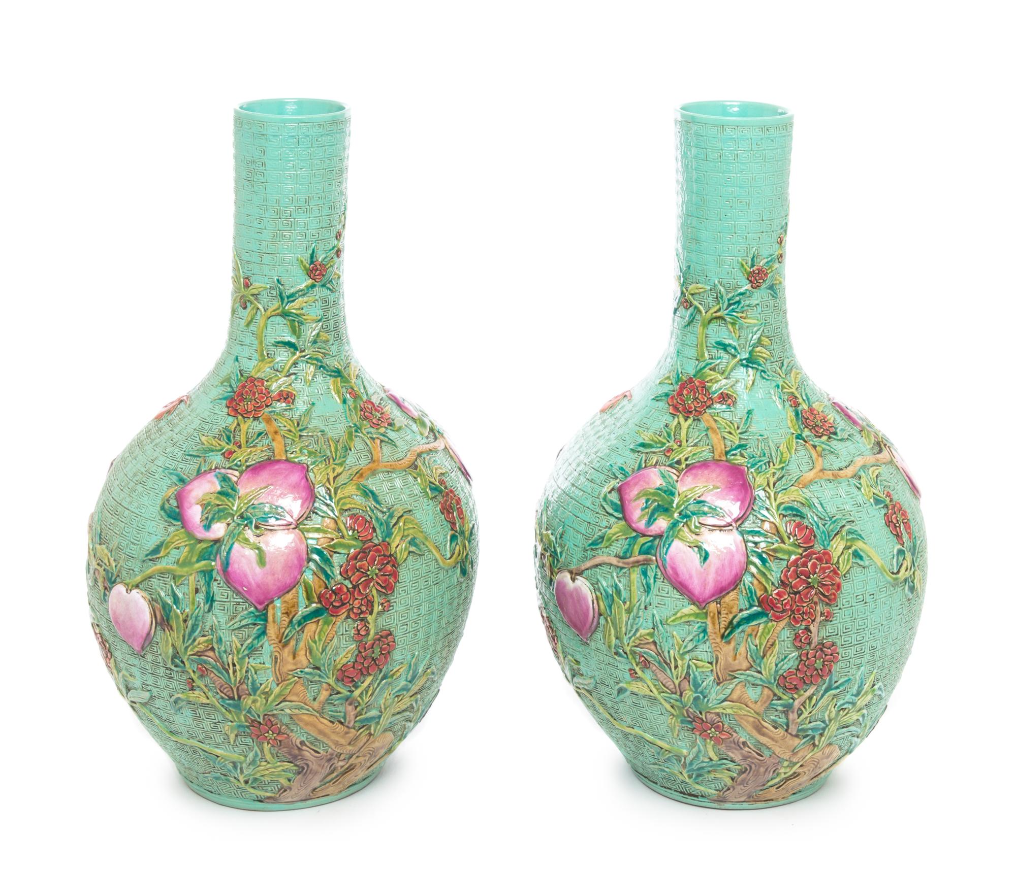 A Pair of Chinese Famille Rose Molded Porcelain Vases Height 16 inches.