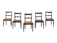 A Set of Five Regency Painted Cane Seat Dining Chairs