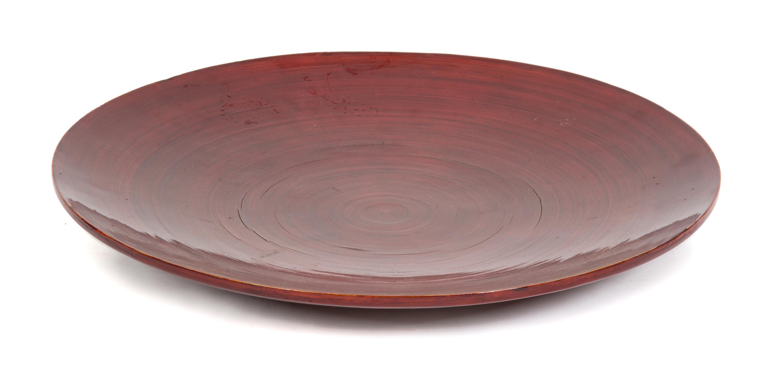 An Asian Red Lacquer Charger Diameter 21 3/4 inches. — 20TH CENTURY