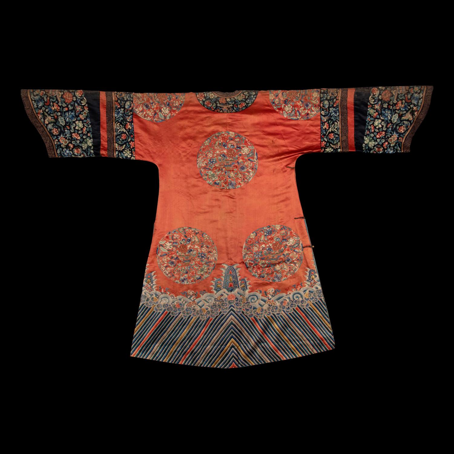 A Chinese Apricot Ground Embroidered 'Peony and Butterfly' Silk Semi-Informal Lady's Robe, Jifupao, late 18th/19th Century 清中期 杏子緞繡八團蝶戀花吉服袍