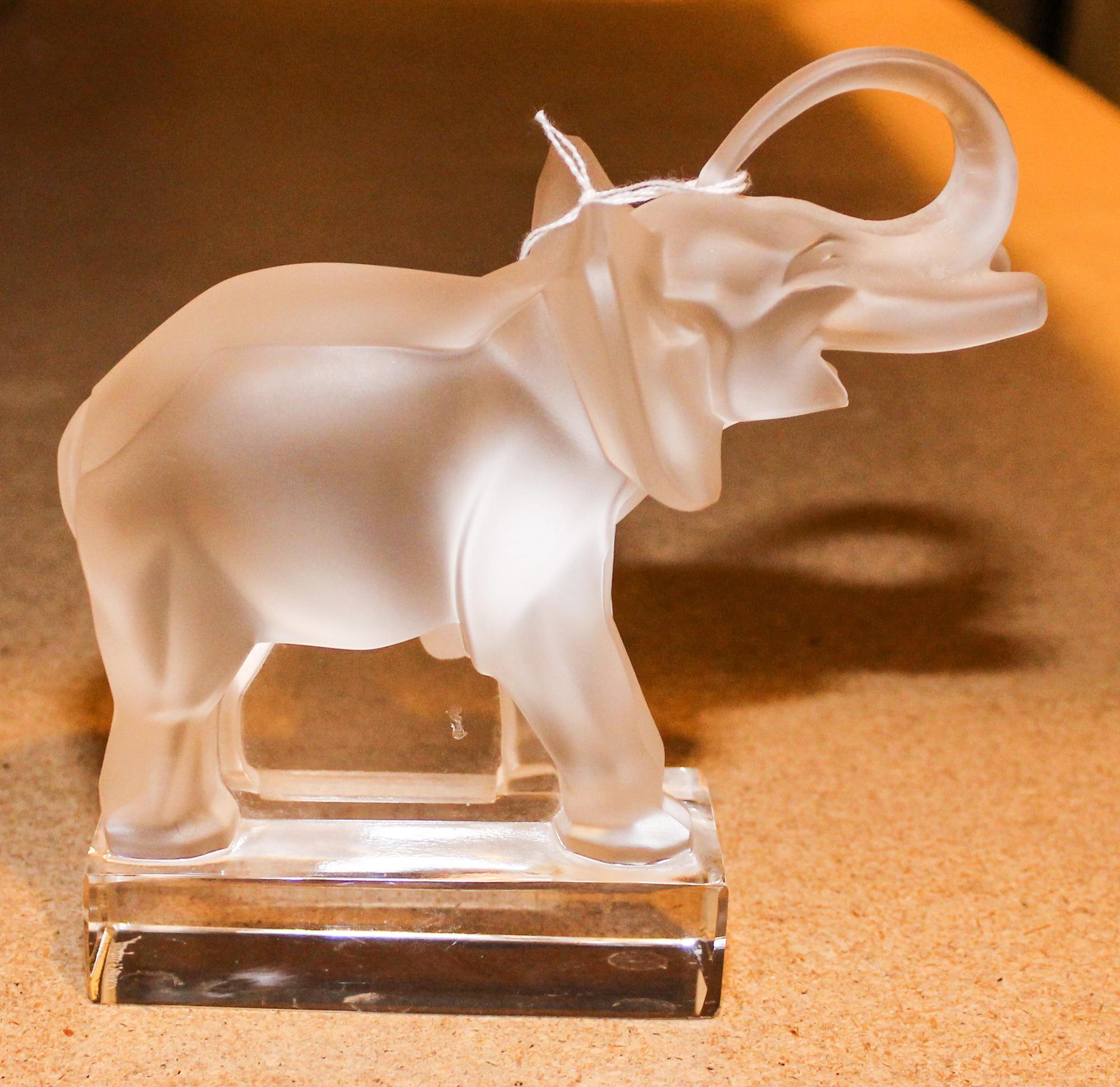 A Lalique Molded Glass Figure of an Elephant. Height 6 1/8 inches.