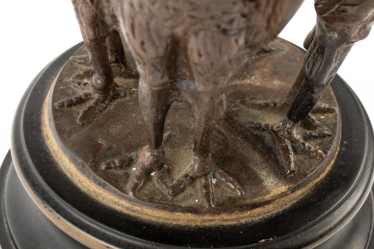 A Rock Crystal Spherical Ornament on a Bird Motif Base