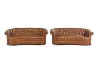 A Pair of Faux Leather Upholstered Chesterfield Sofas