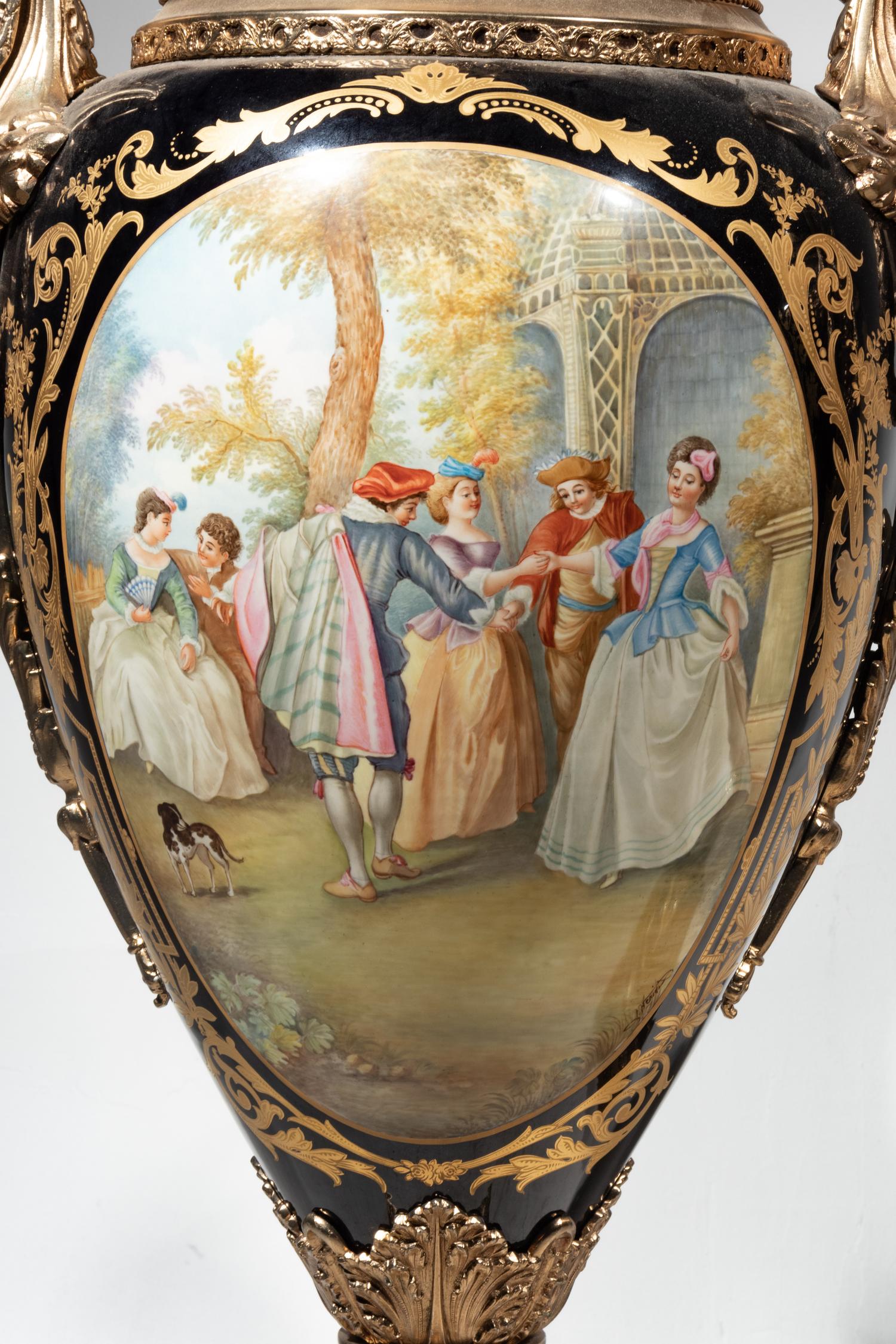 A Pair of Monumental Sèvres Style Gilt Metal Mounted Porcelain Covered Urns on Pedestals