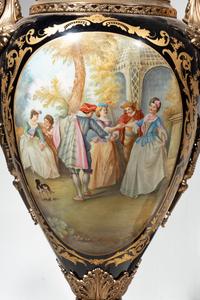 A Pair of Monumental Sèvres Style Gilt Metal Mounted Porcelain Covered Urns on Pedestals