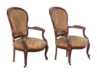 A Pair of Victorian Rococo Revival Walnut Armchairs