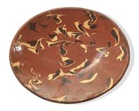 An Oval Redware Bread Dish with Marbleized Slip, New England, 19th Century