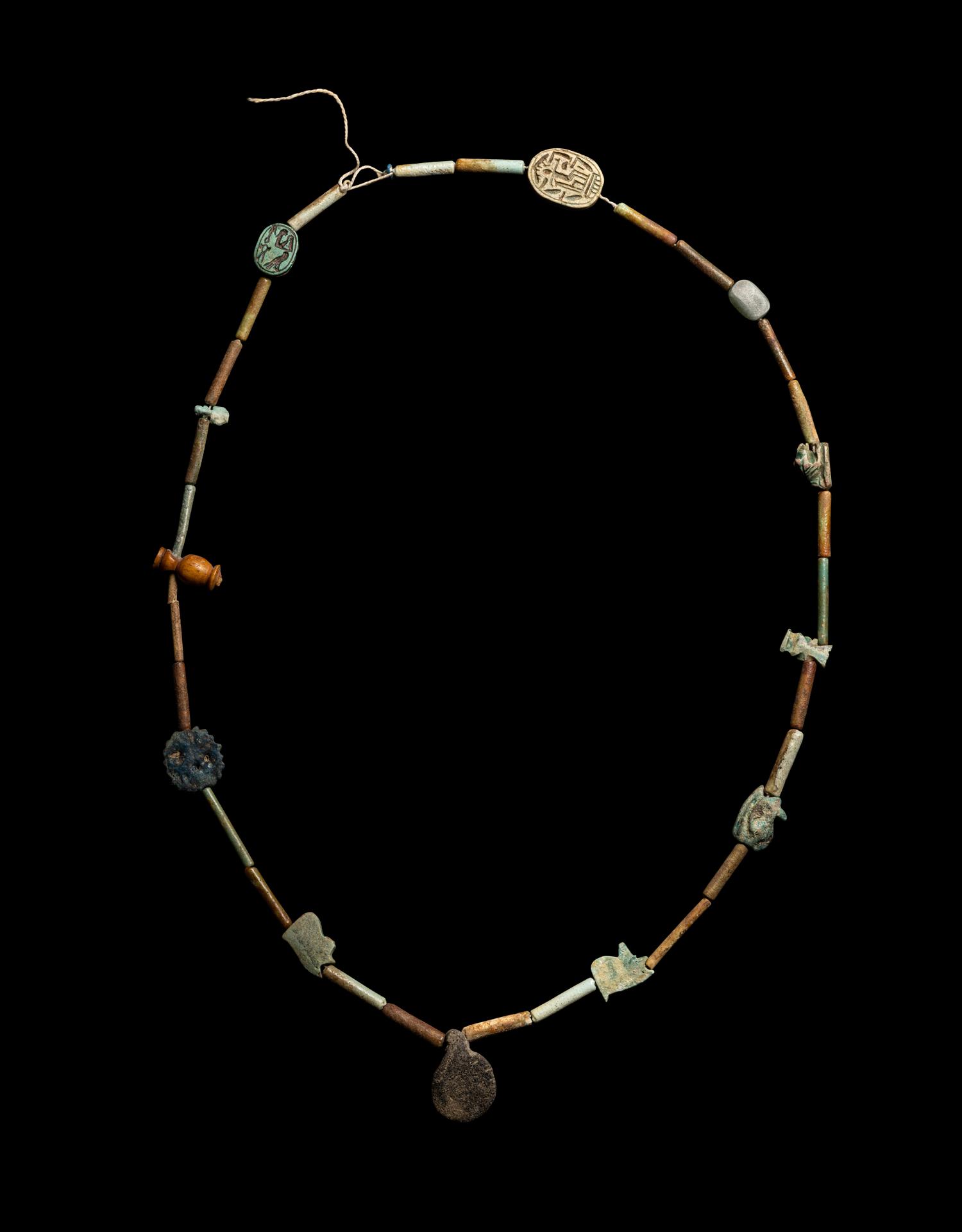 An Egyptian Faience Bead and Amulet Necklace