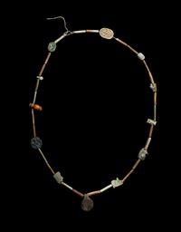 An Egyptian Faience Bead and Amulet Necklace