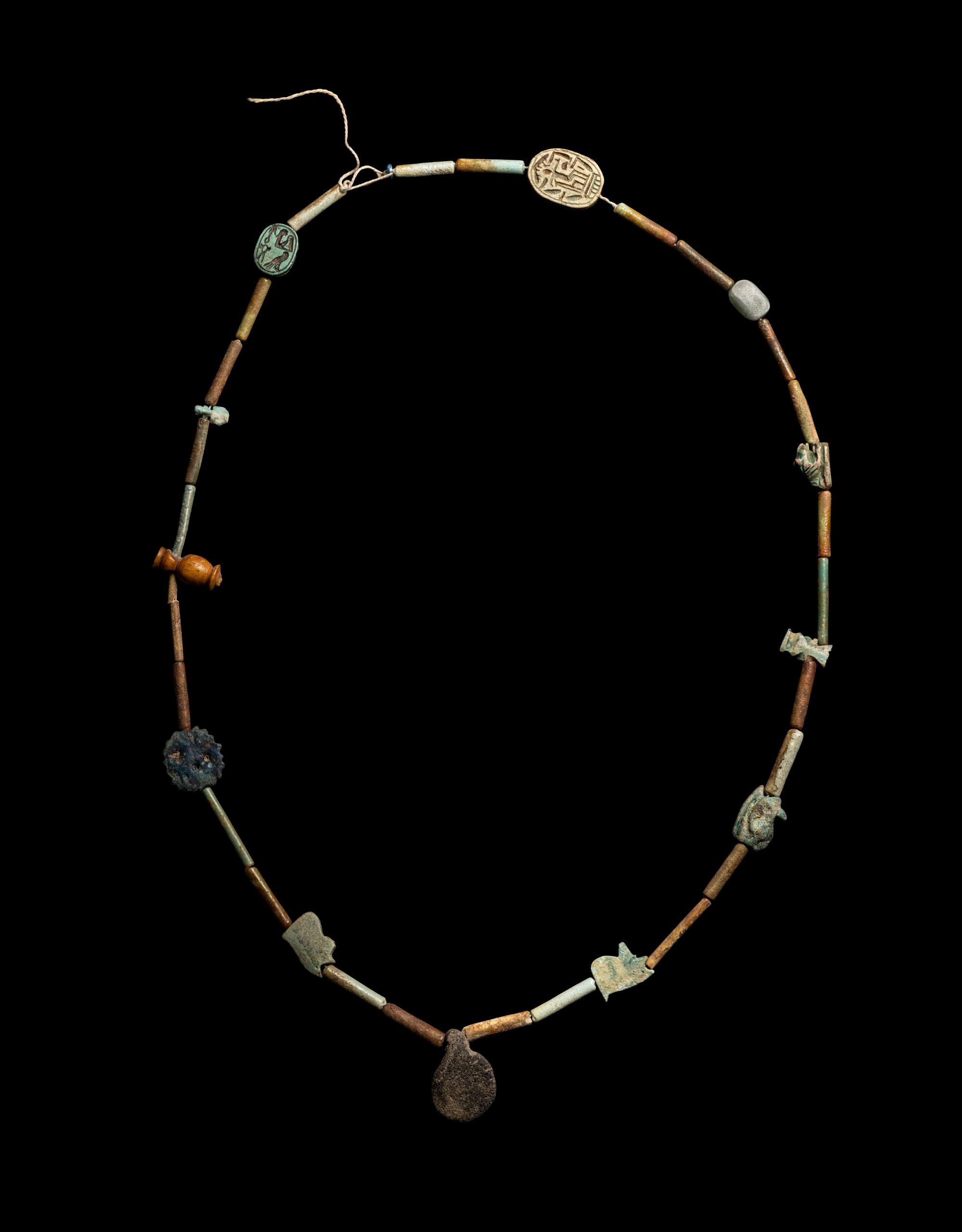 An Egyptian Faience Bead and Amulet Necklace