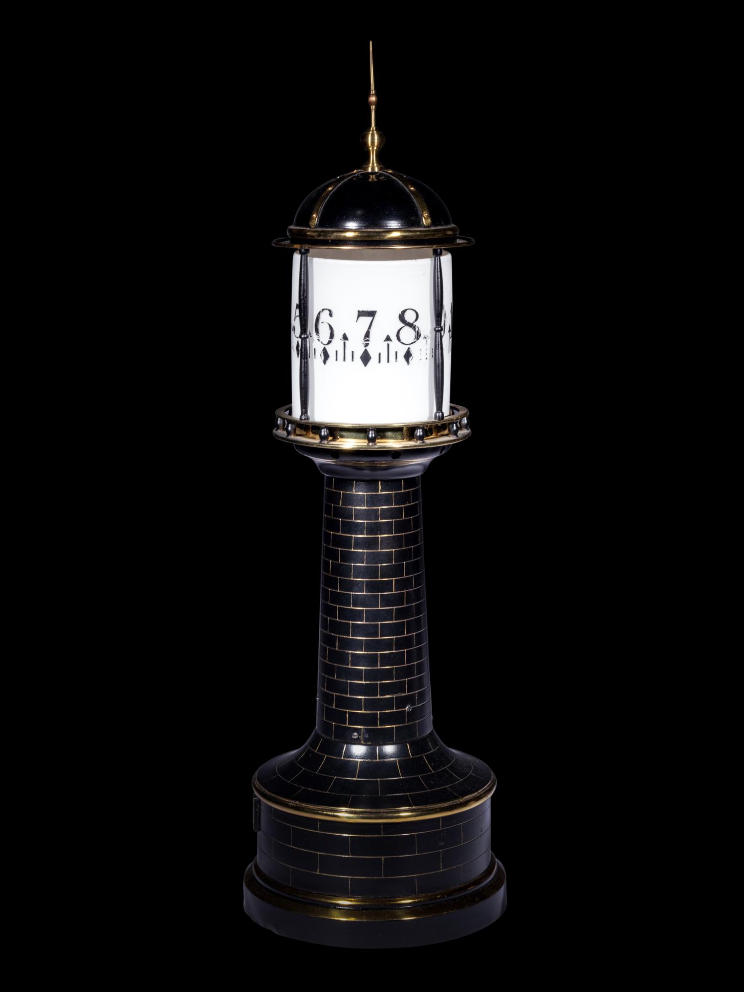 A Gilt and Patinated Lighthouse Annular Clock