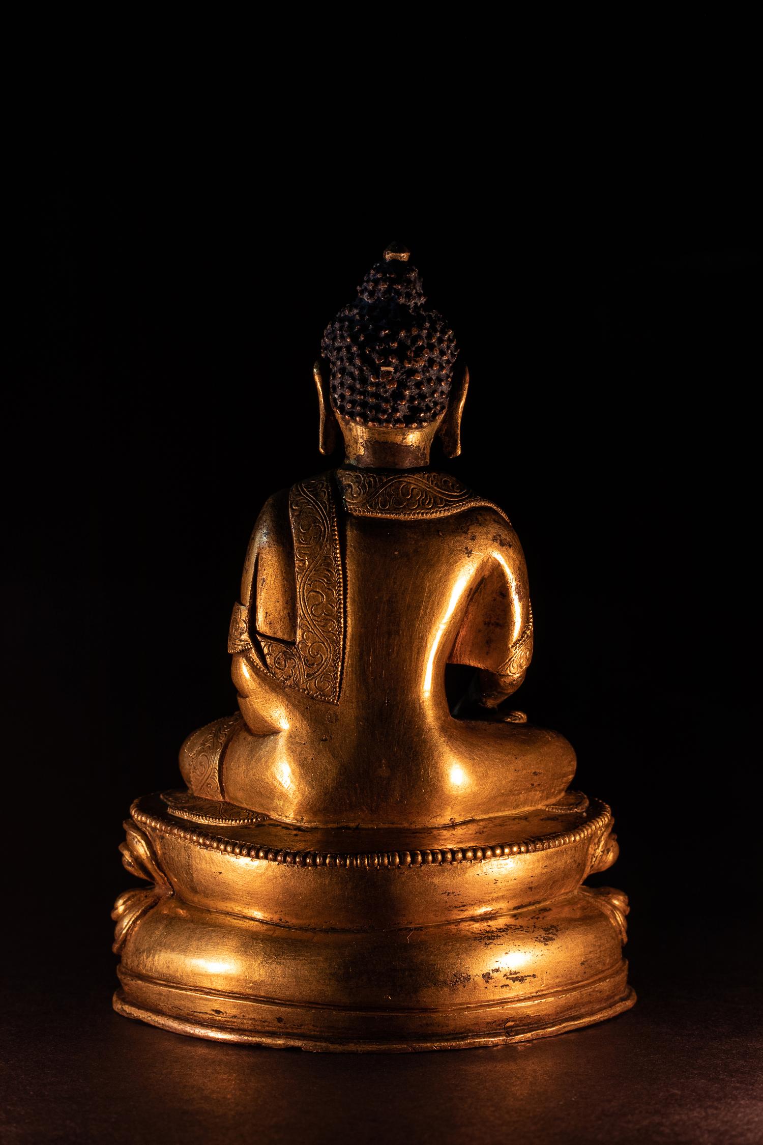 A Small Sino-Tibetan Gilt Bronze Figure of Seated Buddha Shakyamuni