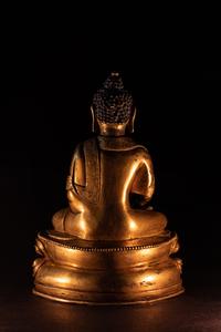 A Small Sino-Tibetan Gilt Bronze Figure of Seated Buddha Shakyamuni