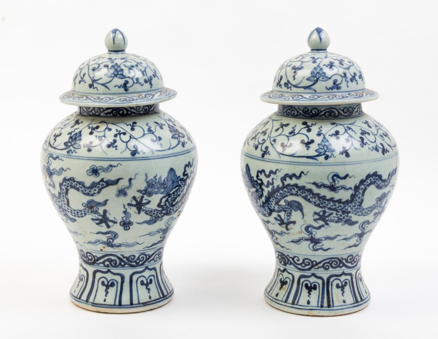 A Pair of Blue and White Porcelain Jars and Covers Height 14 inches.