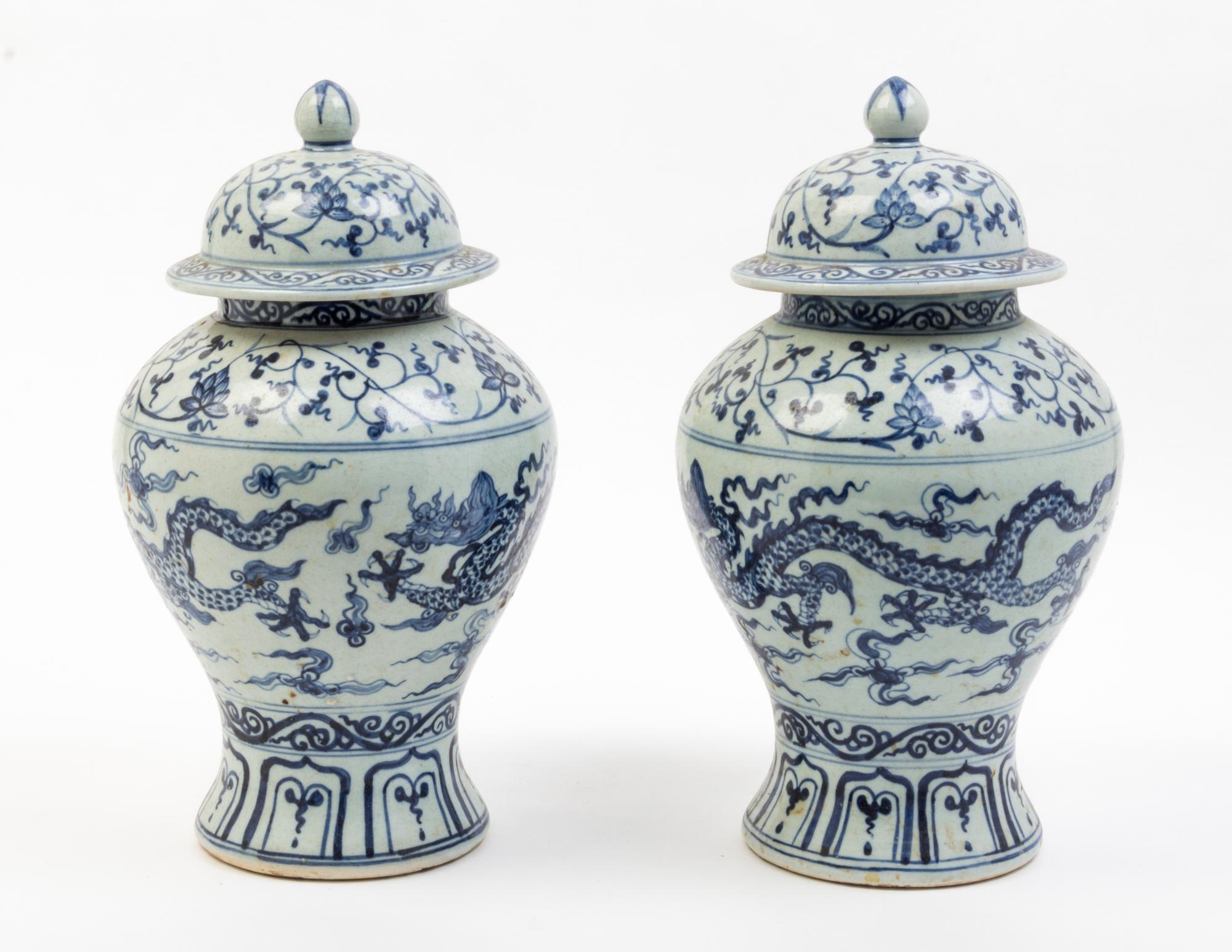 A Pair of Blue and White Porcelain Jars and Covers Height 14 inches.