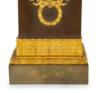 A Gilt Bronze Eagle Sculpture on an Empire Style Gilt and Patinated Bronze Base