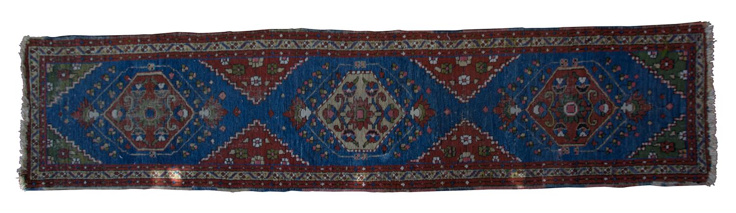A Persian Wool Runner 9 feet 4 inches x 2 feet 1 inch. — FIRST HALF 20TH CENTURY