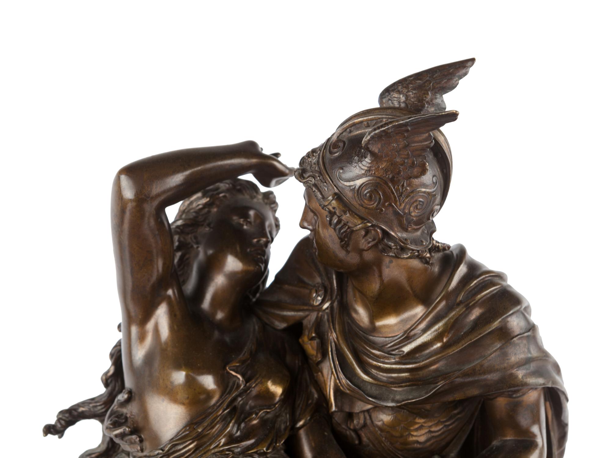 A French Gilt and Patinated Bronze and Marble Mantel Clock