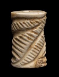 A Mesopotamian Limestone Cylinder Seal