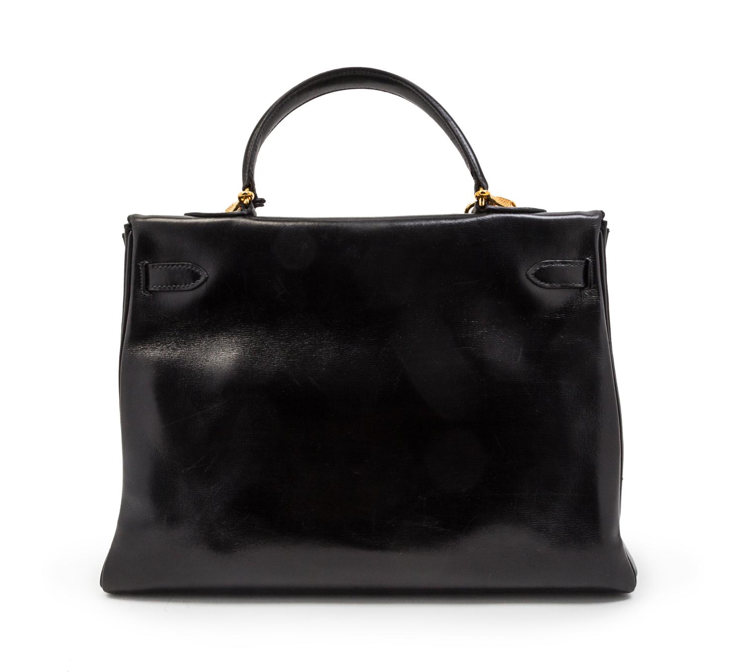 An Hermes 35cm Black Leather Kelly Bag, 14 x 8 x 7 inches.