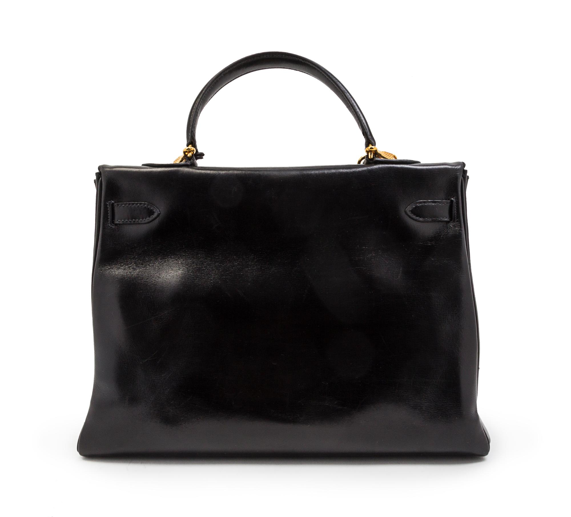 An Hermes 35cm Black Leather Kelly Bag, 14 x 8 x 7 inches.