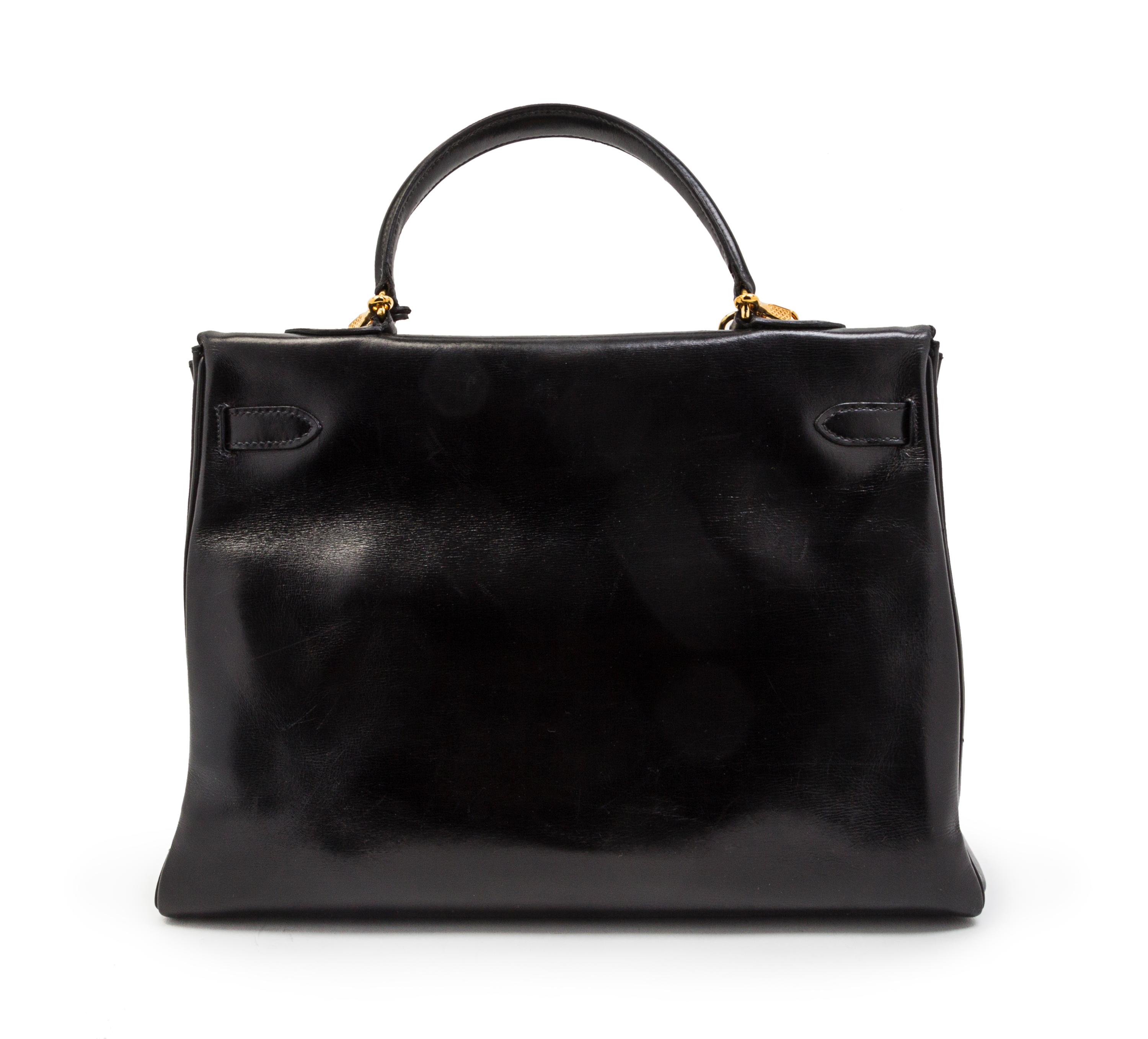 An Hermes 35cm Black Leather Kelly Bag, 14 x 8 x 7 inches.