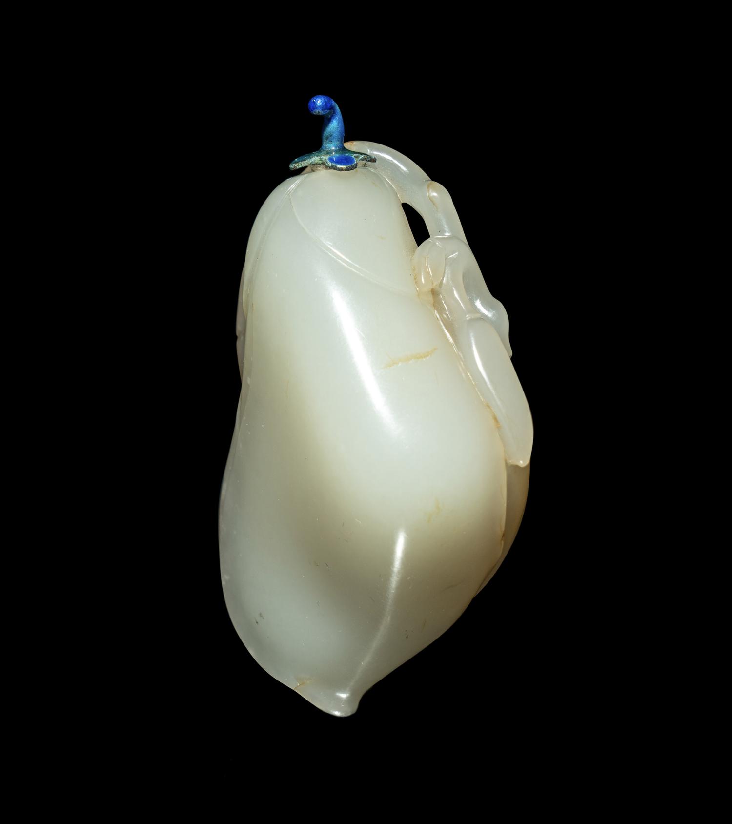 A Chinese Russet and White Jade ‘Magnolia’ Snuff Bottle