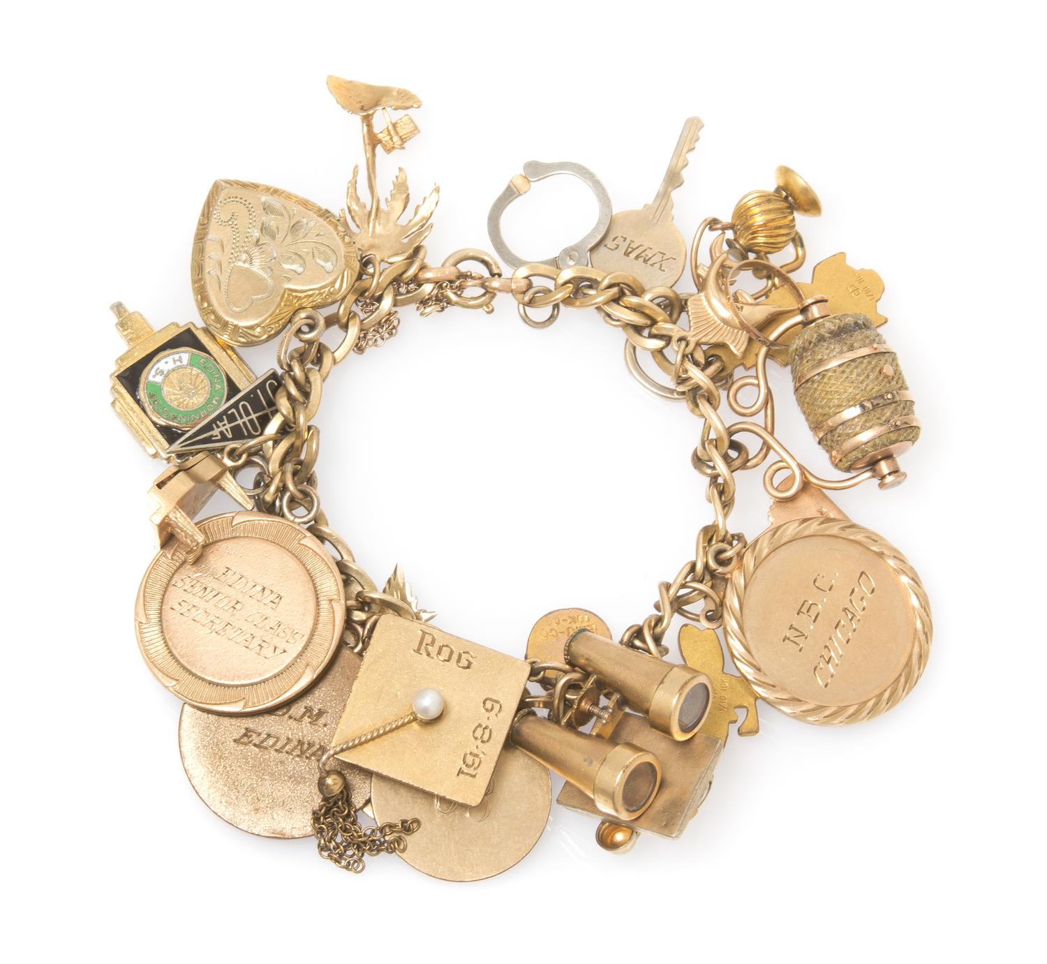 A Vintage Yellow Gold Charm Bracelet with Twenty-Four Attached Charms, 41.20 dwts.