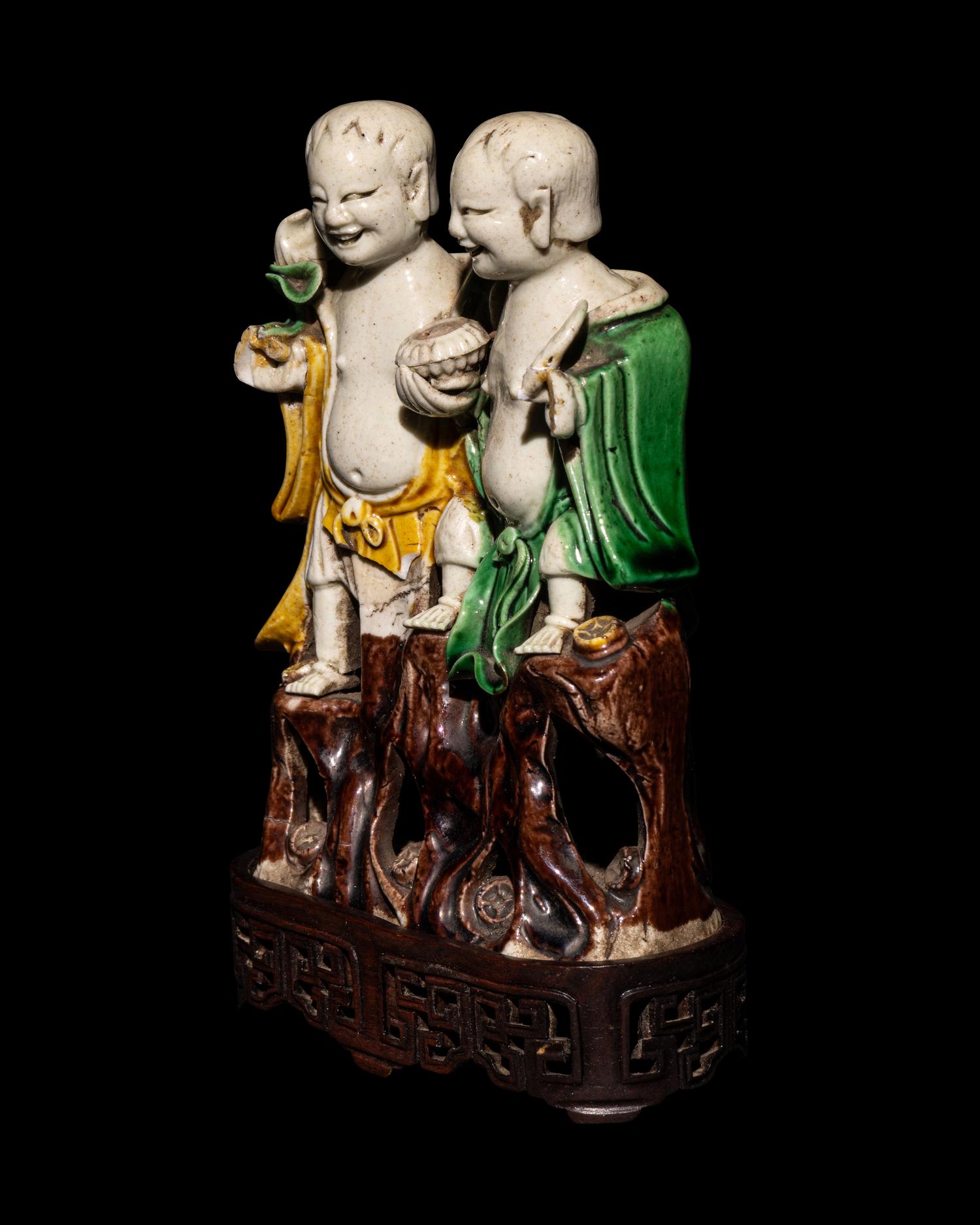 A Chinese Sanca i Glazed Porcelain Figural Group