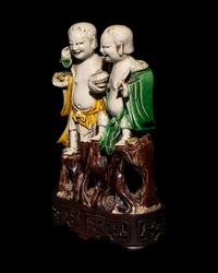 A Chinese Sanca i Glazed Porcelain Figural Group