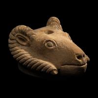 A Romano-Egyptian Style Sandstone Head of a Ram