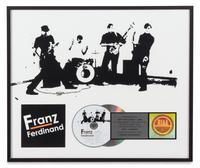 A Franz Ferdinand: Self Titled RIAA Certified Platinum Presentation Album 17 x 19 3/4 inches.
