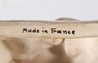 A French White Glazed Faience Chinoiserie Figure