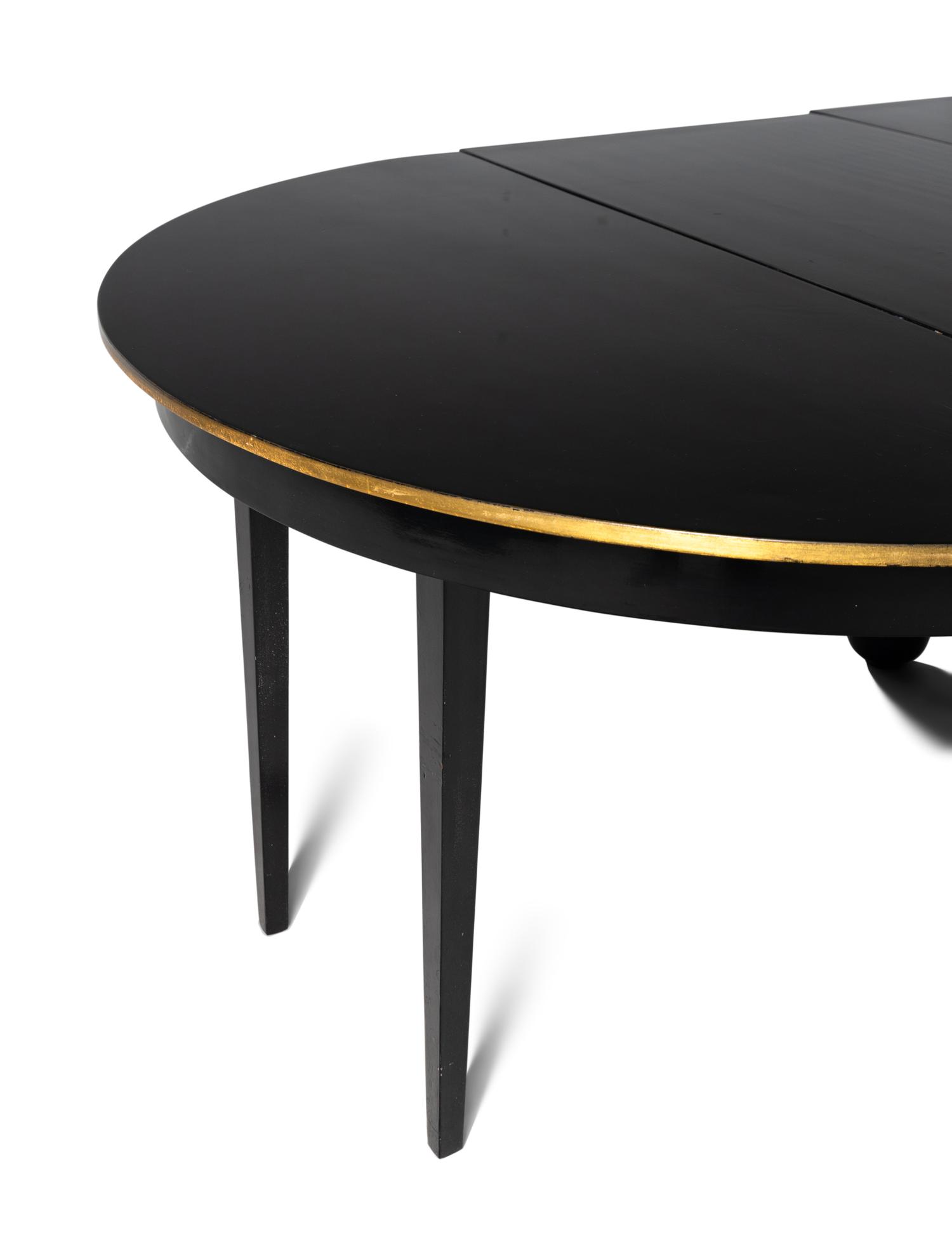 A Biedermeier Black Painted and Parcel-Gilt Pedestal Dining Table