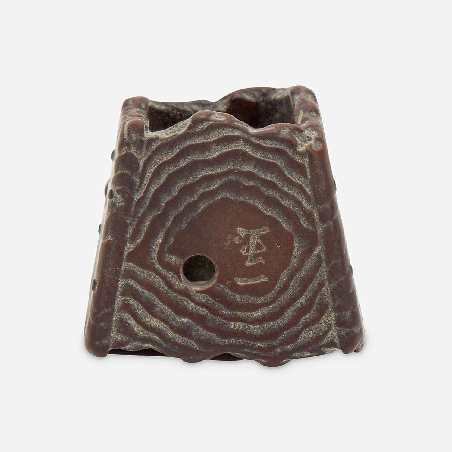 Three Japanese carved wood netsuke: measure and toad, snake and toad, monk and jar