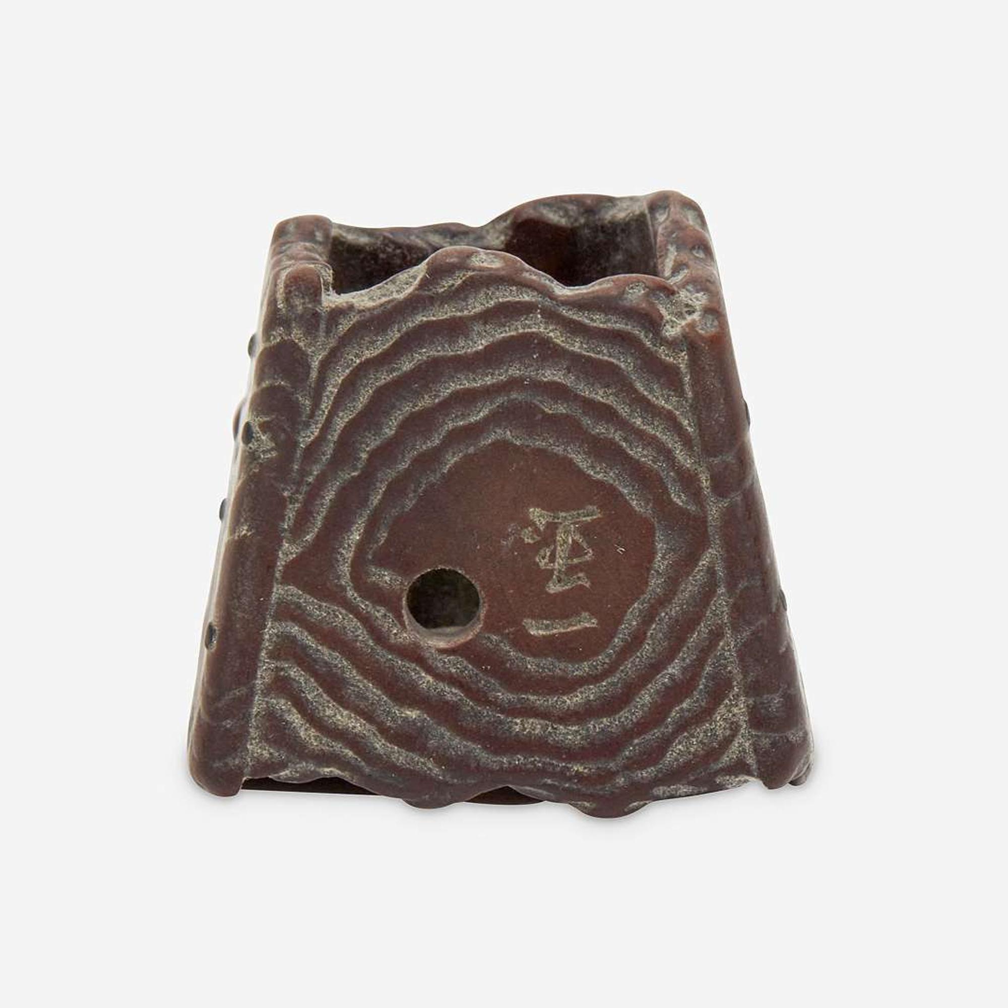 Three Japanese carved wood netsuke: measure and toad, snake and toad, monk and jar