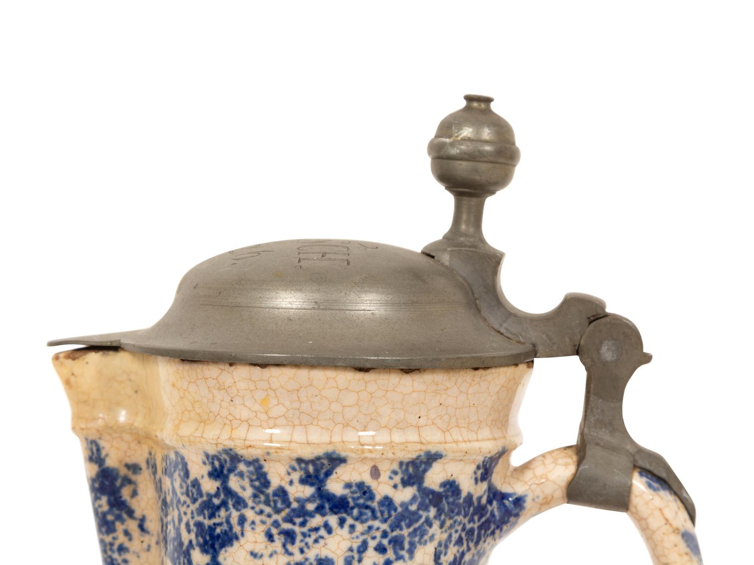A Pewter Mounted Blue and White Spatterware Tankard